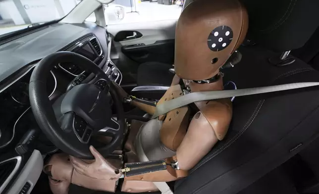 A THOR-5F female crash test dummy is shown in a drivers seat at Humanetics in Farmington Hills, Mich., Tuesday, June 10, 2025. (AP Photo/Paul Sancya)