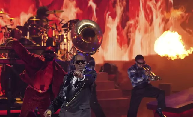 Snoop Dogg, center, performs a medley during the BET Awards on Monday, June 9, 2025, at the Peacock Theater in Los Angeles. (AP Photo/Chris Pizzello)