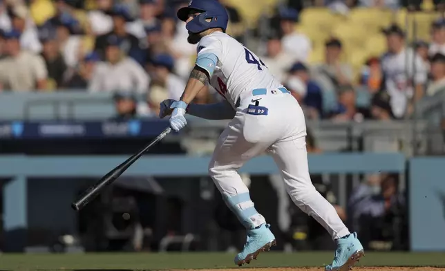 Los Angeles Dodgers' Andy Pages watches his home run during the fifth inning of a baseball game against the San Francisco Giants in Los Angeles, Sunday, June 15, 2025. (AP Photo/Jessie Alcheh)