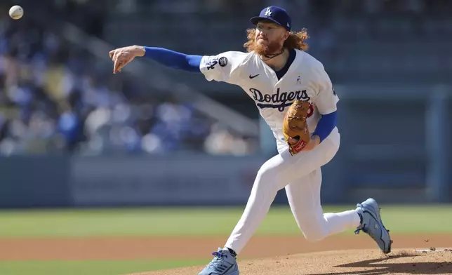 Los Angeles Dodgers pitcher Dustin May (85) delivers to a San Francisco Giants batter during the first inning of a baseball game in Los Angeles, Sunday, June 15, 2025. (AP Photo/Jessie Alcheh)