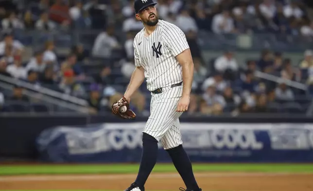 New York Yankees pitcher Carlos Rodón reacts after giving up a two-run home run against the Boston Red Sox during the fifth inning of a baseball game, Sunday, June 8, 2025, in New York. (AP Photo/Noah K. Murray)