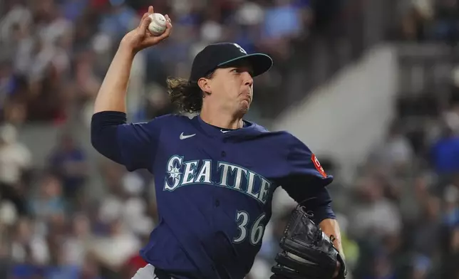 Seattle Mariners starting pitcher Logan Gilbert throws during the first inning of a baseball game against the Texas Rangers, Friday, June 27, 2025, in Arlington, Texas. (AP Photo/LM Otero)