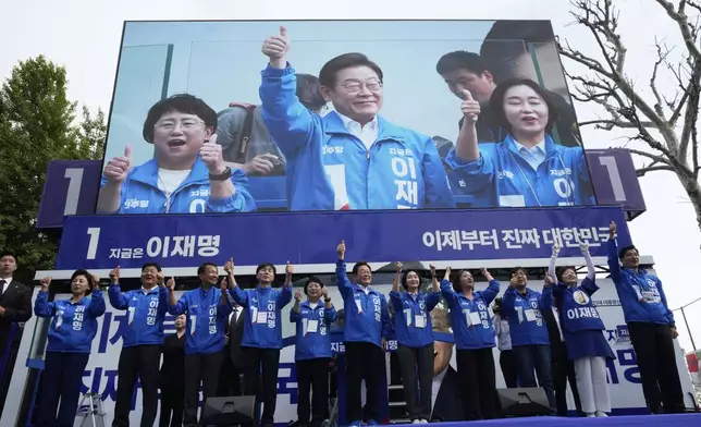South Korea's Democratic Party's presidential candidate Lee Jae-myung, center, reacts with his party members during a presidential election campaign at Jamsil Sports Complex in Seoul, South Korea, Thursday, May 29, 2025. (AP Photo/Ahn Young-joon)