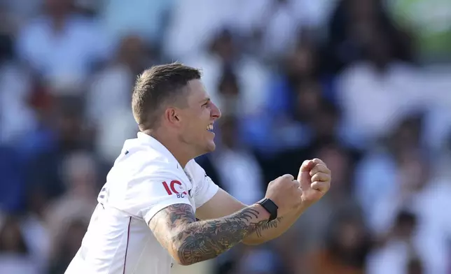 England's Brydon Carse celebrates the dismissal of India's Karun Nair during the fourth day of the third cricket test match between England and India at Lord's cricket ground in London, Sunday, July 13, 2025.(AP Photo/Richard Pelham)