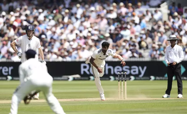 India's Nitish Kumar Reddy, center, bowls a delivery during the fourth day of the third cricket test match between England and India at Lord¥s cricket ground in London, Sunday, July 13, 2025.(AP Photo/Richard Pelham)