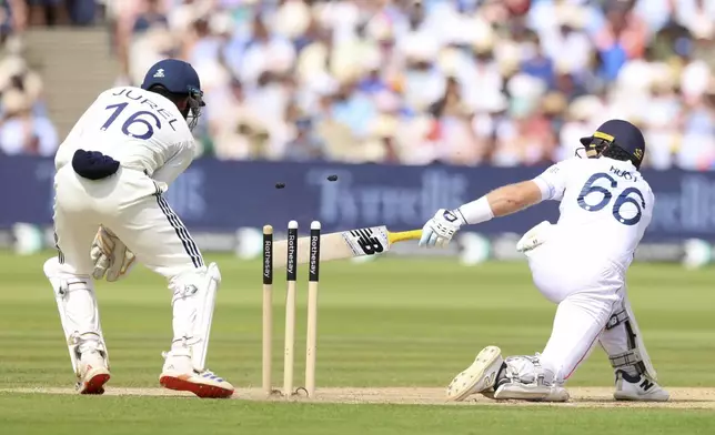 England's Joe Root bowled out by India's Washington Sundar during the fourth day of the third cricket test match between England and India at Lord's cricket ground in London, Sunday, July 13, 2025.(AP Photo/Richard Pelham)