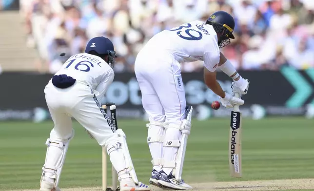 England's Jamie Smith bowled out by India's Washington Sundar during the fourth day of the third cricket test match between England and India at Lord's cricket ground in London, Sunday, July 13, 2025.(AP Photo/Richard Pelham)