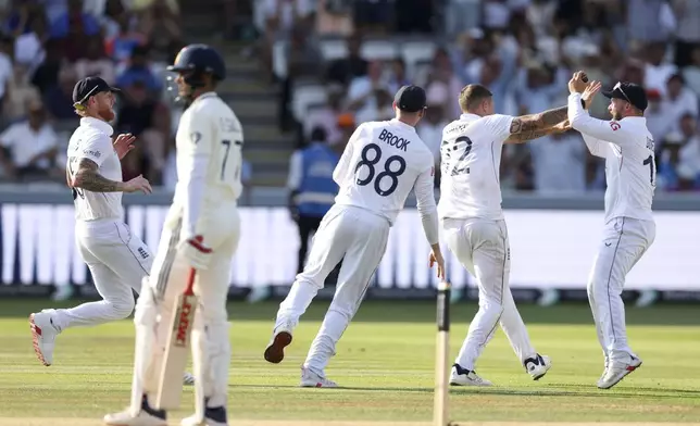 England's Brydon Carse, second right, celebrates with teammates after the dismissal of India's captain Shubman Gill, second left, during the fourth day of the third cricket test match between England and India at Lord's cricket ground in London, Sunday, July 13, 2025.(AP Photo/Richard Pelham)