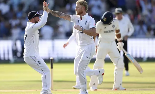 England's captain Ben Stokes, right, celebrates with teammates after the dismissal of the dismissal of India's Akash Deep during the fourth day of the third cricket test match between England and India at Lord's cricket ground in London, Sunday, July 13, 2025.(AP Photo/Richard Pelham)