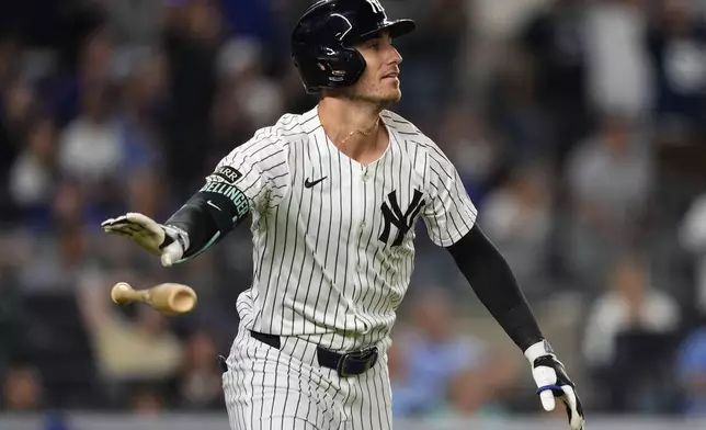 New York Yankees' Cody Bellinger (35) hits a home run during the eighth inning of a baseball game against the Chicago Cubs, Friday, July 11, 2025, in New York. (AP Photo/Yuki Iwamura)