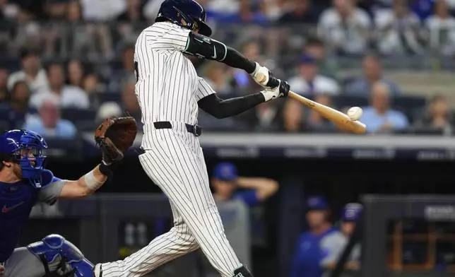 New York Yankees' Cody Bellinger hits a home run during the fifth inning of a baseball game against the Chicago Cubs, Friday, July 11, 2025, in New York. (AP Photo/Yuki Iwamura)