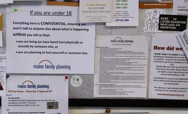Flyers and documents are posted on a patient bulletin board in an examination room at the Maine Family Planning healthcare facility, July 15, 2025, in Thomaston, Maine. (AP Photo/Charles Krupa)