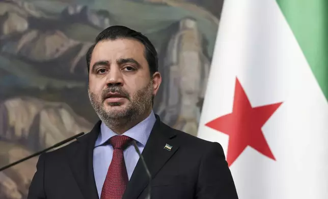 Syrian Foreign Minister Asaad Hassan al-Shibani attends a joint news conference with Russian Foreign Minister Sergey Lavrov following their meeting in Moscow, Russia, Thursday, July 31, 2025. (Shamil Zhumatov/ Pool Photo via AP)