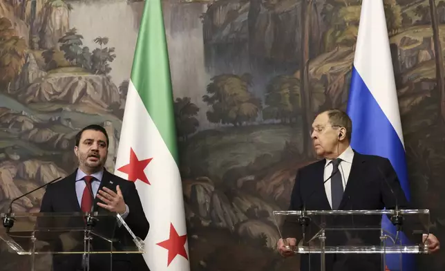 Russian Foreign Minister Sergey Lavrov, right, and Syrian Foreign Minister Asaad Hassan al-Shibani, left, attend a joint news conference following their meeting in Moscow, Russia, Thursday, July 31, 2025. (Shamil Zhumatov/ Pool Photo via AP)