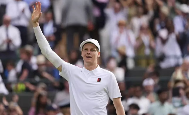 Jannik Sinner of Italy celebrates winning the men's singles quarter final match against Ben Shelton of the U.S. at the Wimbledon Tennis Championships in London, Wednesday, July 9, 2025.(AP Photo/Kirsty Wigglesworth)