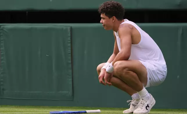 Ben Shelton of the U.S. reacts during the men's singles quarter final match against Jannik Sinner of Italy at the Wimbledon Tennis Championships in London, Wednesday, July 9, 2025.(AP Photo/Kirsty Wigglesworth)