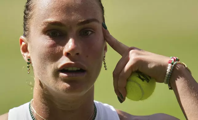 Aryna Sabalenka of Belarus reacts as she plays Amanda Anisimova of the U.S. during a women's singles semifinal match at the Wimbledon Tennis Championships in London, Thursday, July 10, 2025. (AP Photo/Kin Cheung)
