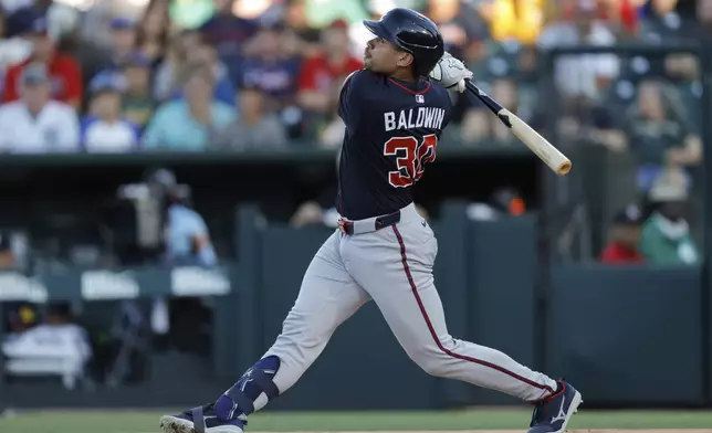 Atlanta Braves' Drake Baldwin hits a three-run home run during the first inning of a baseball game against the Athletics, Wednesday, July 9, 2025, in West Sacramento, Calif. (AP Photo/Sergio Estrada)