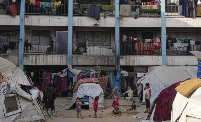FILE - Displaced Palestinians live in a school run by UNRWA, the U.N. agency, in Gaza City, Monday, June 23, 2025. (AP Photo/Jehad Alshrafi, File)