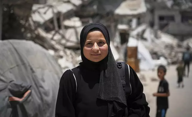 Sarah Qanan poses for a photo in Khan Younis, Gaza Strip, on June 28, 2025. (AP Photo/Abdel Kareem Hana)