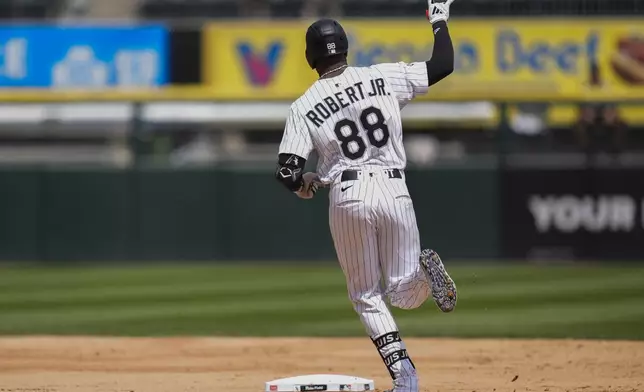 Chicago White Sox's Luis Robert Jr. (88) runs the bases after hitting a two-run home run during the second inning of the first baseball game of a doubleheader against the Cleveland Guardians, Friday, July 11, 2025, in Chicago. (AP Photo/Erin Hooley)