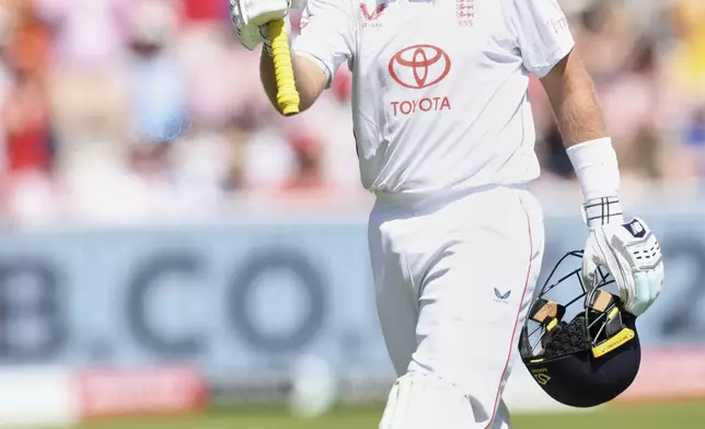 England's Joe Root walks off the field after losing his wicket during the third cricket test match between England and India at Lord's cricket ground in London, Friday, July 11, 2025. (AP Photo/Richard Pelham)