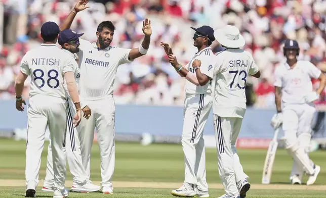 India's Jasprit Bumrah, left, celebrates with teammates after the dismissal of England's Jofra Archer during the third cricket test match between England and India at Lord's cricket ground in London, Friday, July 11, 2025. (AP Photo/Richard Pelham)