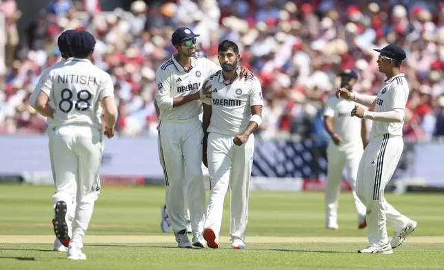 India's Jasprit Bumrah, middle, celebrates with teammates after the dismissal of during the third cricket test match between England and India at Lord's cricket ground in London, Friday, July 11, 2025. (AP Photo/Richard Pelham)