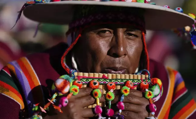 An Indigenous Aymara musician performs during the 15th National Camelid Expo, in El Alto, Bolivia, Saturday, July 26, 2025, as part of the country's Bicentennial celebrations. (AP Photo/Juan Karita)