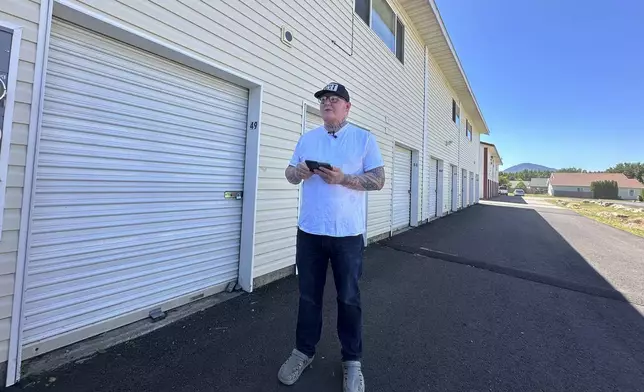 T.J. Franks Jr. speaks with reporters outside his apartment building on Monday, June 30, 2025, in Sandpoint, Idaho. (AP Photo/Manuel Valdes)
