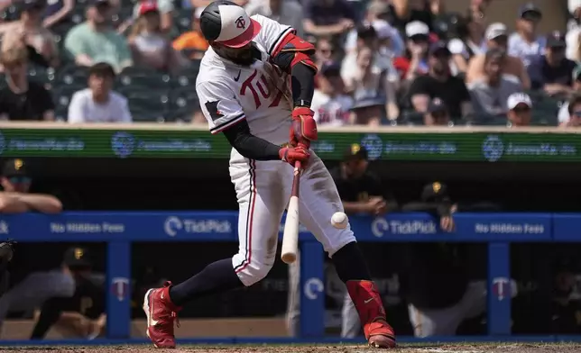 Minnesota Twins' Byron Buxton (25) hits a solo home run for the cycle during the seventh inning of a baseball game against the Pittsburgh Pirates, Saturday, July 12, 2025, in Minneapolis. (AP Photo/Abbie Parr)