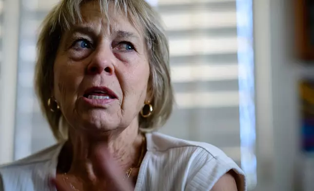 Christine Bennett talks about about the positive impact the League of the Blessed Sacrament, a lay group of young Catholics, have had on the youth in her community in Concho, Ariz., Saturday, June 21, 2025. (AP Photo/Roberto E. Rosales)