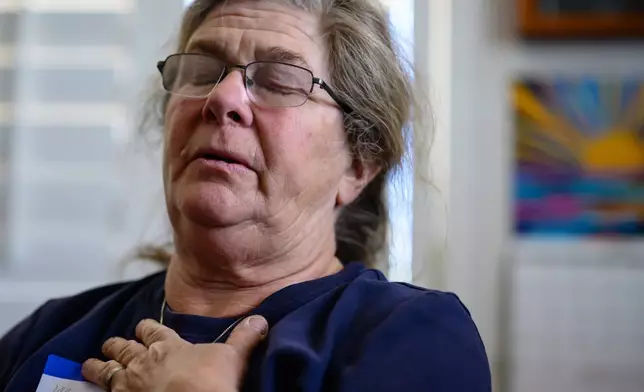 Mary Ramirez speaks on the positive impact the League of the Blessed Sacrament, a lay group of young Catholics, have had in her village, in the Arizona high desert that is home to about 50 people, in Concho, Ariz., Saturday, June 21, 2025. (AP Photo/Roberto E. Rosales)
