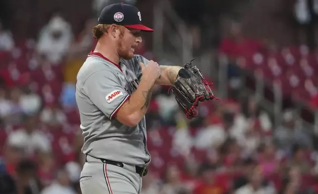 Washington Nationals relief pitcher Mason Thompson pauses after giving up a ground-rule double to St. Louis Cardinals' Lars Nootbaar during the sixth inning of a baseball game Thursday, July 10, 2025, in St. Louis. (AP Photo/Jeff Roberson)