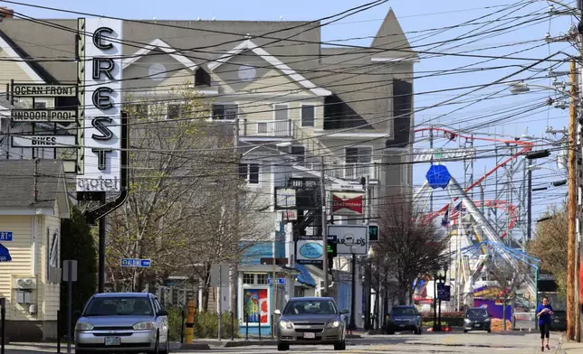FILE - In this Thursday, May 7, 2020 photo, a main drag is quiet in Old Orchard Beach, Maine, just weeks before the summer tourist season starts. (AP Photo/Robert F. Bukaty, File)