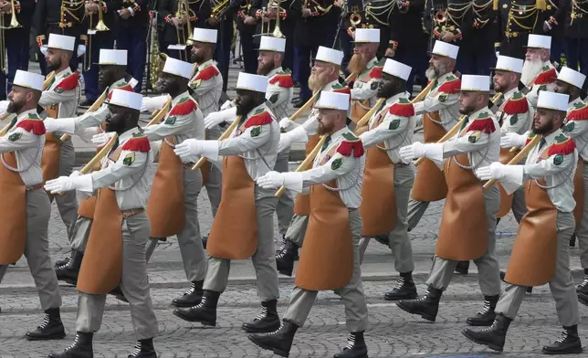Soldiers of the Foreign Legion march during the Bastille Day parade, Monday, July 14, 2025 in Paris. (AP Photo/Michel Euler)