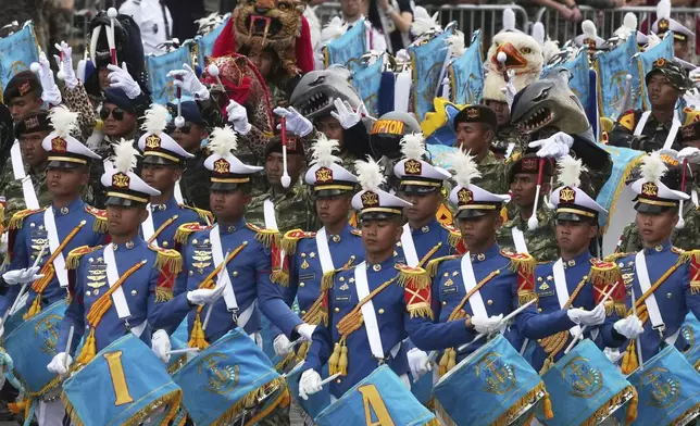 Indonisian army band members march march during the Bastille Day parade, Monday, July 14, 2025 in Paris. (AP Photo/Michel Euler)
