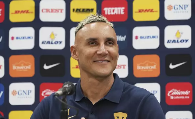 Costa Rican goalkeeper Keylor Navas smiles during his presentation as Pumas' new soccer player in Mexico City, Thursday, July 24, 2025. (AP Photo/Eduardo Verdugo)