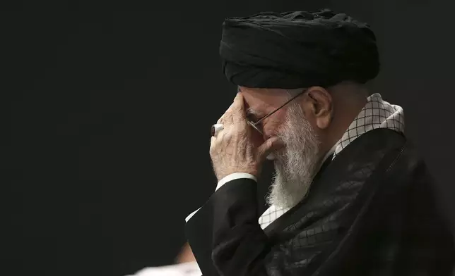In this photo provided by the Office of the Iranian Supreme Leader, Supreme Leader Ayatollah Ali Khamenei attends a mourning ceremony commemorating the death anniversary of the Prophet Muhammad's grandson, Hussein, in Tehran, Iran, on Saturday, July 6, 2025. (Office of the Iranian Supreme Leader via AP)