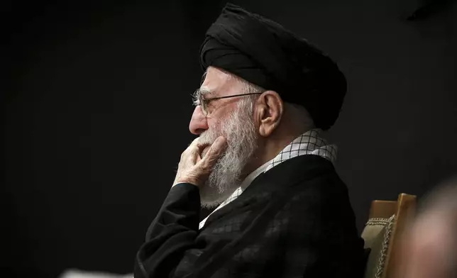 In this photo provided by the Office of the Iranian Supreme Leader, Supreme Leader Ayatollah Ali Khamenei attends a mourning ceremony commemorating the death anniversary of the Prophet Muhammad's grandson, Hussein, in Tehran, Iran, on Saturday, July 6, 2025. (Office of the Iranian Supreme Leader via AP)