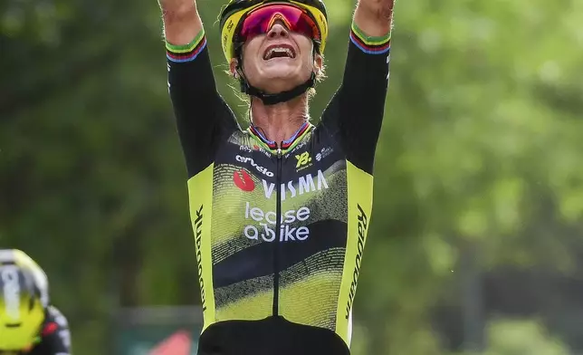 Netherland's Marianne Vos reacts as she crosses the finish line to win the first stage of the Women's Tour de France cycling race which starts in Vannes and finishes in Plumelec, Saturday, July 26, 2025 in Plumelec, Brittany, western France. (AP Photo/Mathieu Pattier)