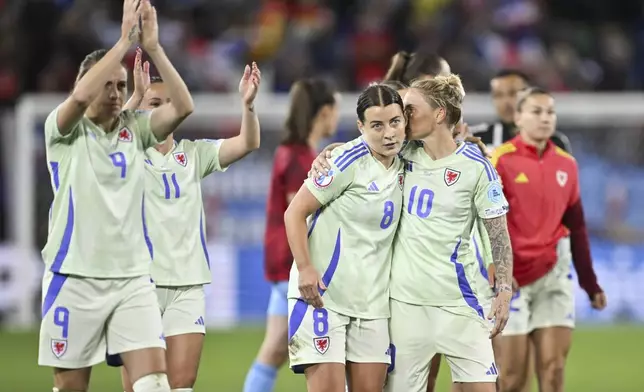 Wales' Angharad Jane James, left, and Jessica Anne Fishlock react after the UEFA Women's EURO 2025 Group D soccer match against France at the Arena St. Gallen in St. Gallen, Switzerland, Wednesday, July 9, 2025. (Gian Ehrenzeller/Keystone via AP)