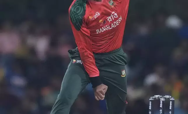 Bangladesh's Rishad Hossain bowls a delivery during the second Twenty20 cricket match between Sri Lanka and Bangladesh in Dambulla, Sri Lanka, Sunday, July 13, 2025. (AP Photo/Eranga Jayawardena)