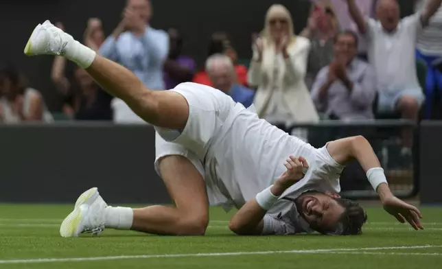 Cameron Norrie of Britain celebrates winning his men's singles fourth round match against Nicolas Jarry of Chile at the Wimbledon Tennis Championships in London, Sunday, July 6, 2025.(AP Photo/Joanna Chan)