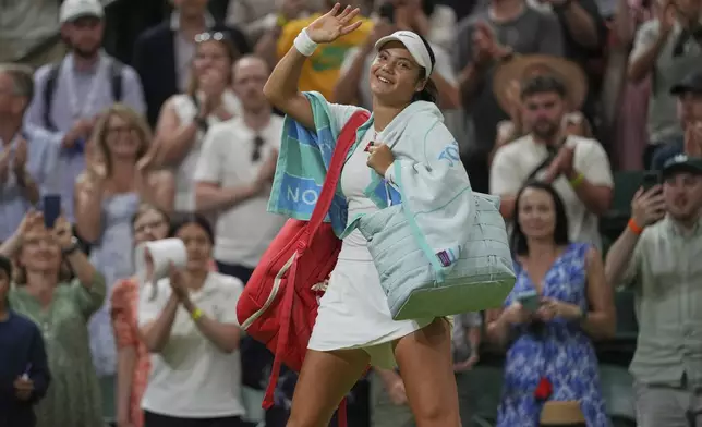 Emma Raducanu of Britain waves as she leaves the court after losing to Aryna Sabalenka of Belarus during a third round women's singles match at the Wimbledon Tennis Championships in London, Friday, July 4, 2025. (AP Photo/Kin Cheung)