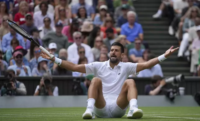 Serbia's Novak Djokovic reacts as he plays against Australia's Alex de Minaur during a fourth round men's singles match at the Wimbledon Tennis Championships in London, Monday, July 7, 2025. (AP Photo/Kin Cheung)