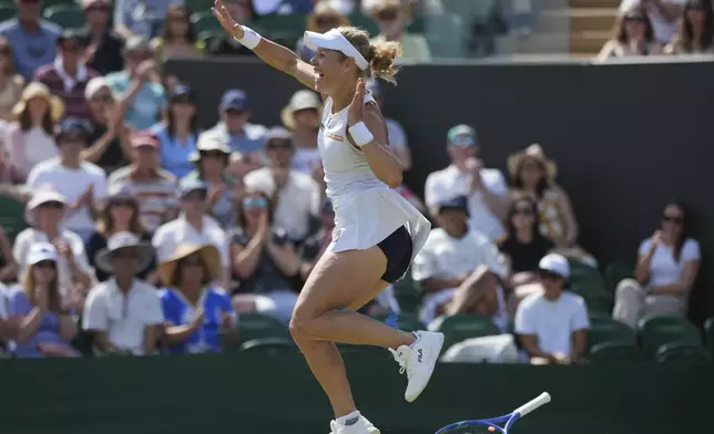 Laura Siegemund of Germany reacts after beating Madison Keys of the U.S. during their women's singles third round match at the Wimbledon Tennis Championships in London, Friday, July 4, 2025. (AP Photo/Alastair Grant)