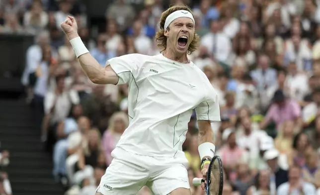 Russia's Andrey Rublev reacts after winning the first set against Spain's Carlos Alcaraz during a fourth round men's singles match at the Wimbledon Tennis Championships in London, Sunday, July 6, 2025. (AP Photo/Alastair Grant)