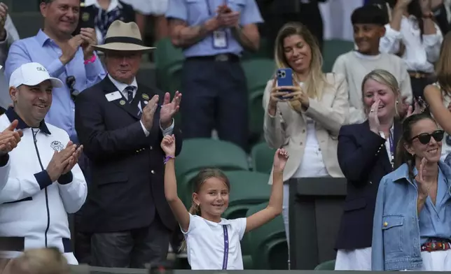 Tara, the daughter of Novak Djokovic of Serbia does a dance as she celebrates her father beating Miomir Kecmanovic of Serbia during a third round men's singles match at the Wimbledon Tennis Championships in London, Saturday, July 5, 2025. (AP Photo/Kirsty Wigglesworth)
