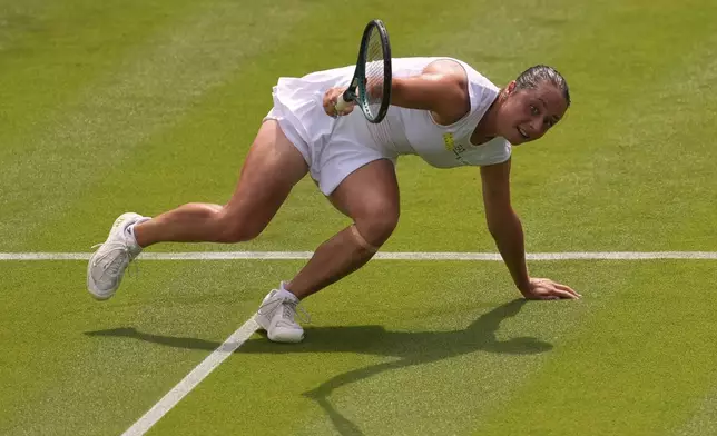 Elisabetta Cocciaretto of Italy gets up after falling during her women's first round singles match against Jessica Pegula of the U.S. at the Wimbledon Tennis Championships in London, Tuesday, July 1, 2025.(AP Photo/Joanna Chan)